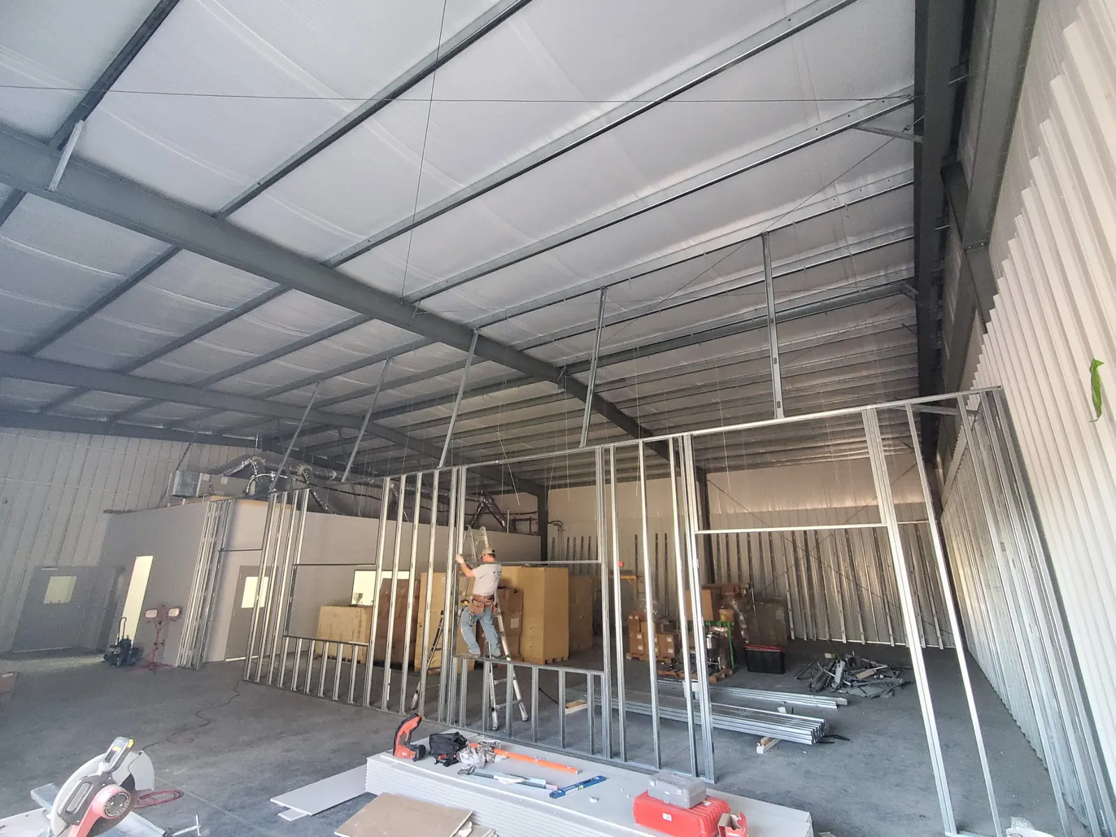 Metal stud framing going up inside a warehouse during a commercial build-out